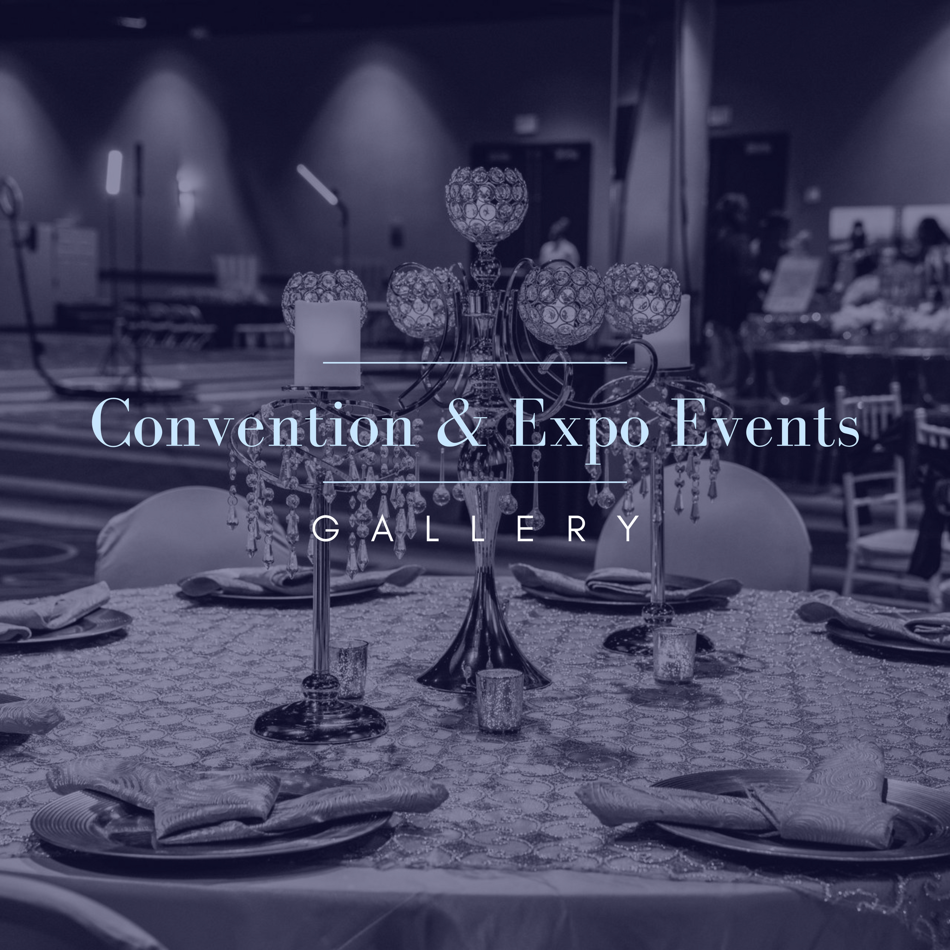 A black and white photo of a table set for a convention and expo event.