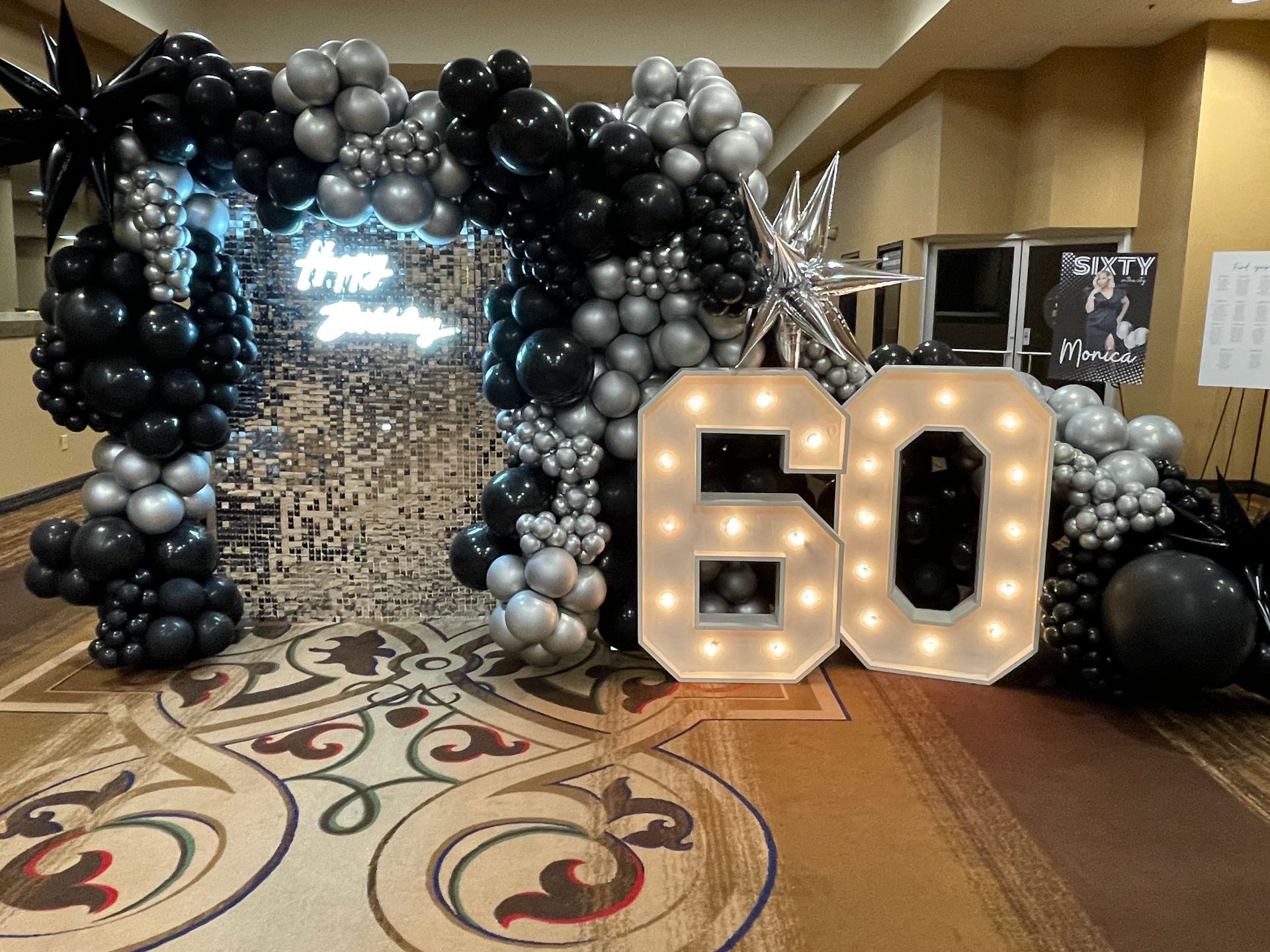 A room filled with balloons and a sign that says `` 60 ''.
