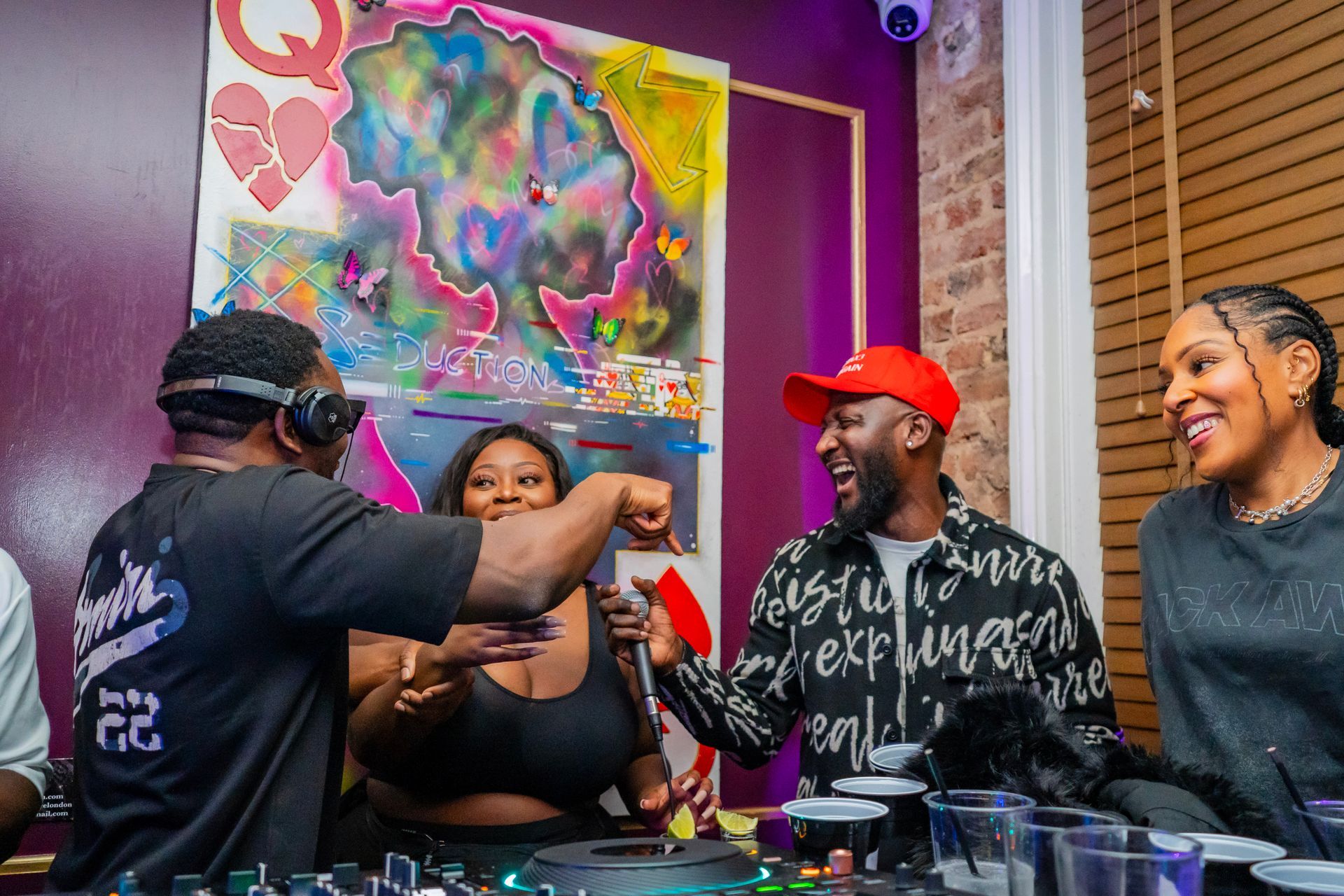 A group of people are sitting around a table in a room.