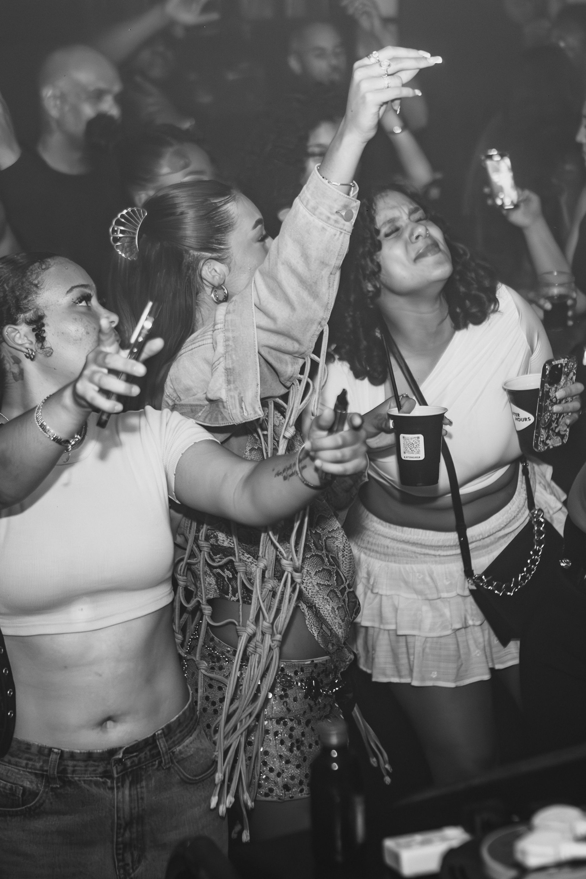 A group of women are taking a picture of themselves at a party.