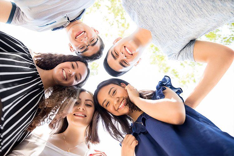 Group of Teenagers in a huddle - Dental Studio 4 Kids Lutz Florida