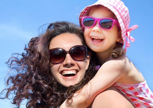 mom and daughter wearing sunglasses