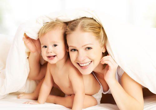 woman and baby smiling