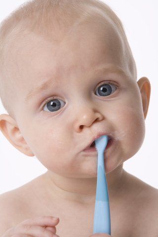 baby brushing teeth