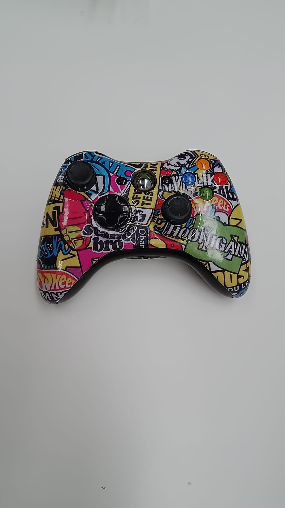 A Colourful Video Game Controller With Graffiti on It is Sitting on a White Surface — Dynamic 2-Pack In Rockville, QLD