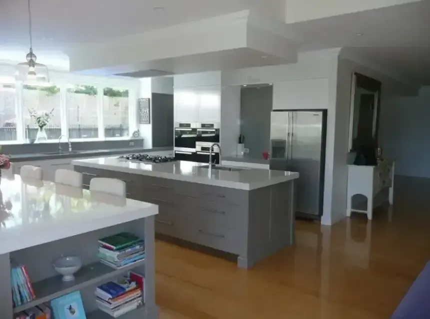 A Kitchen With White Cabinets , a Refrigerator, a Sink, a Table and Chairs — Dynamic 2-Pack In Rockville, QLD