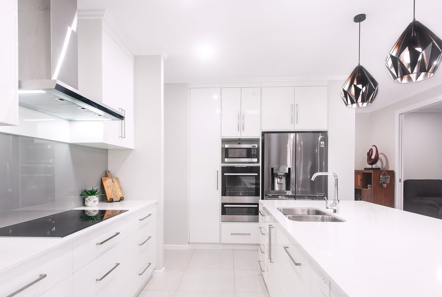 A Kitchen With White Cabinets and Stainless Steel Appliances — Dynamic 2-Pack In Rockville, QLD