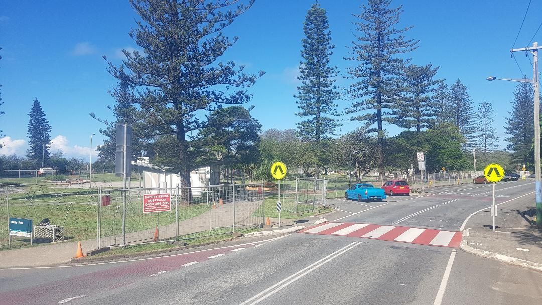 Car is Driving Down a Road Next to a Crosswalk — Safety Fence Australia in Middle Pocket, NSW