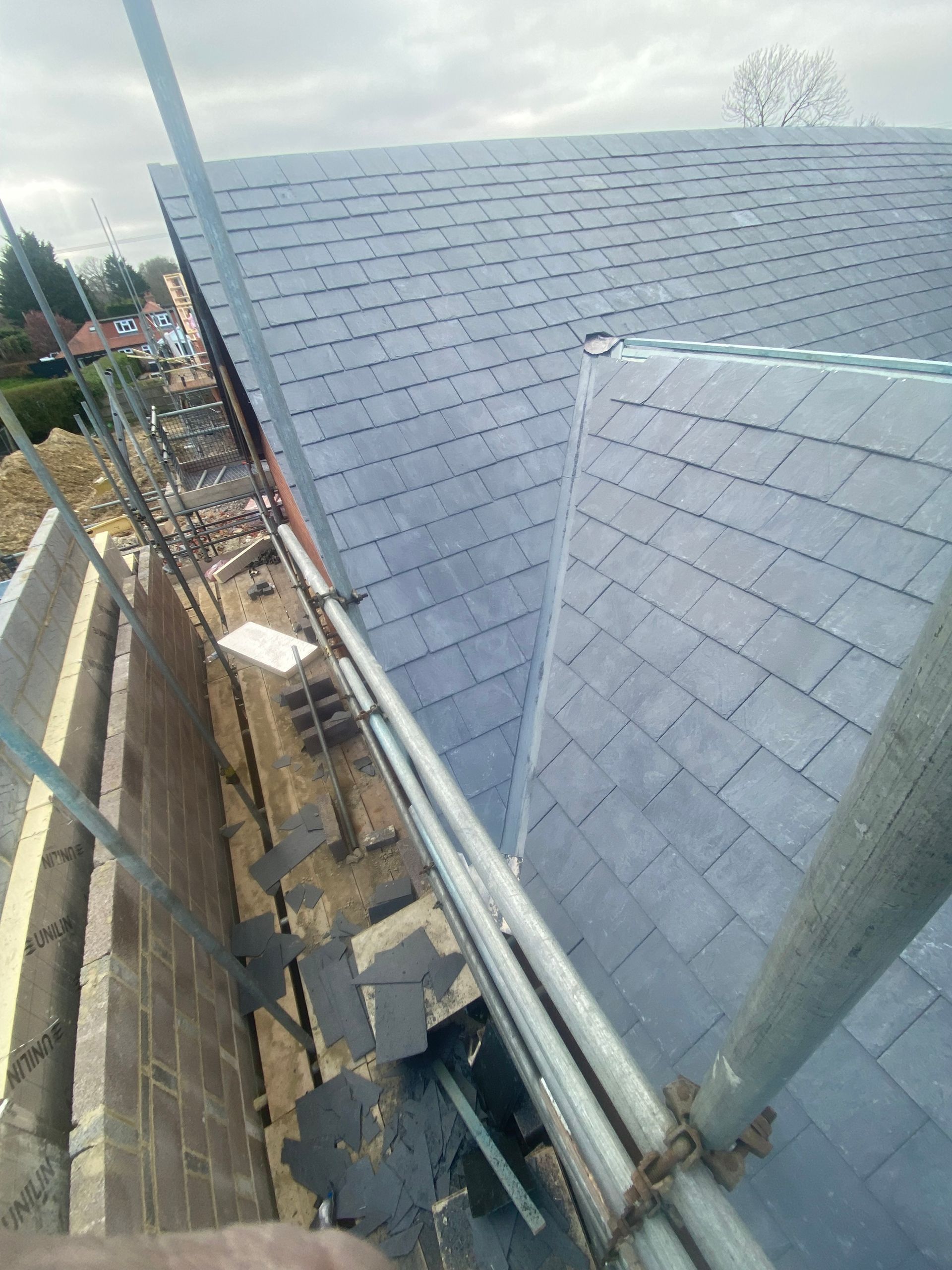 A roof with scaffolding on it is being built.