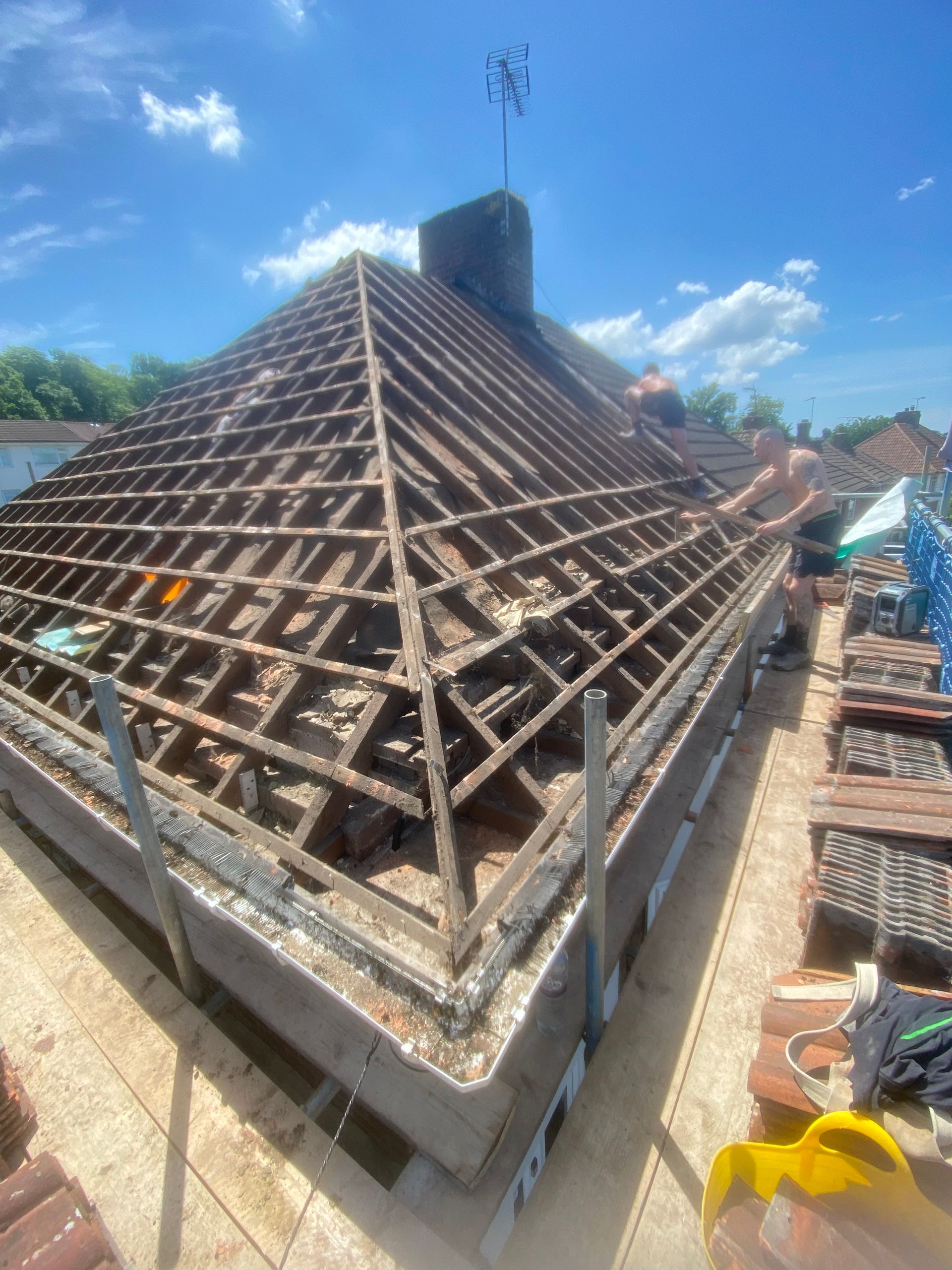 The roof of a building is being built and the roof is being removed.