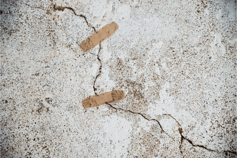 concrete with bandaid on top