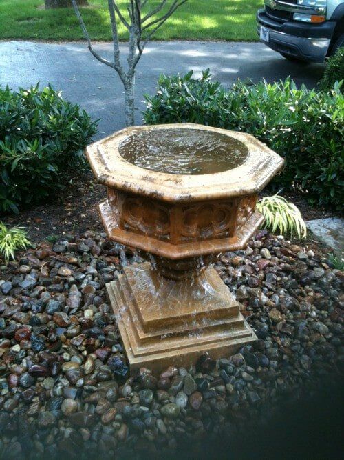 Mini fountain in the garden — Water fountain repair in Lexington KY