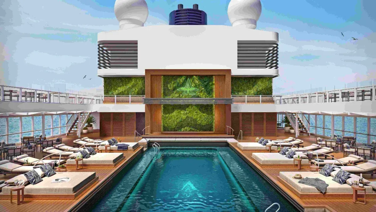 Luxurious two-story living space with multiple seating areas, a staircase, and a central water feature.