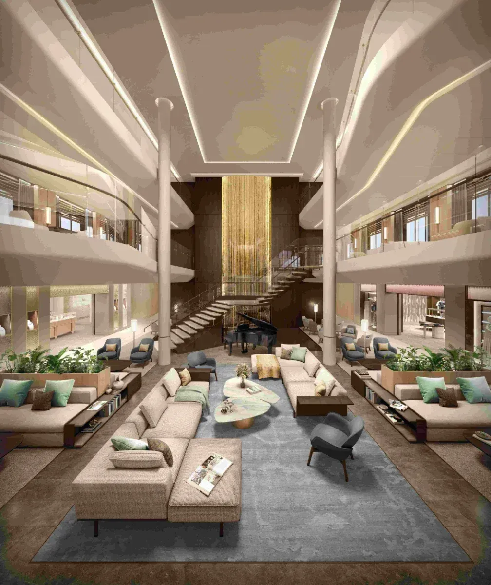 Luxurious two-story lounge with plush seating, grand staircase, and a central piano. Neutral tones with teal accents.