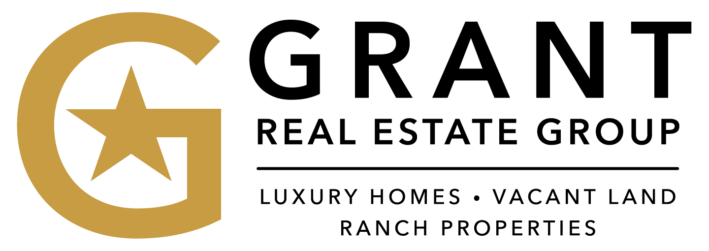 Hands holding keys, framed by a house outline.