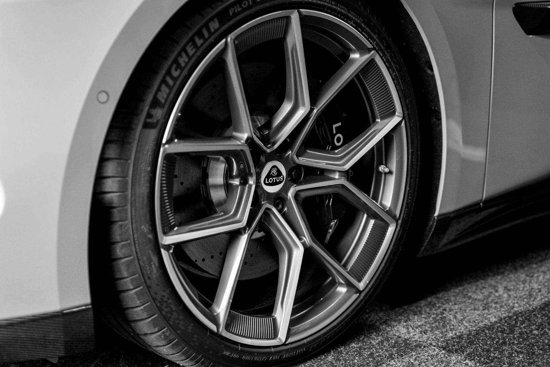A close up of a car wheel with a michelin tyre