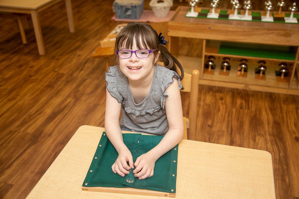 Montessori child working on practical life skills