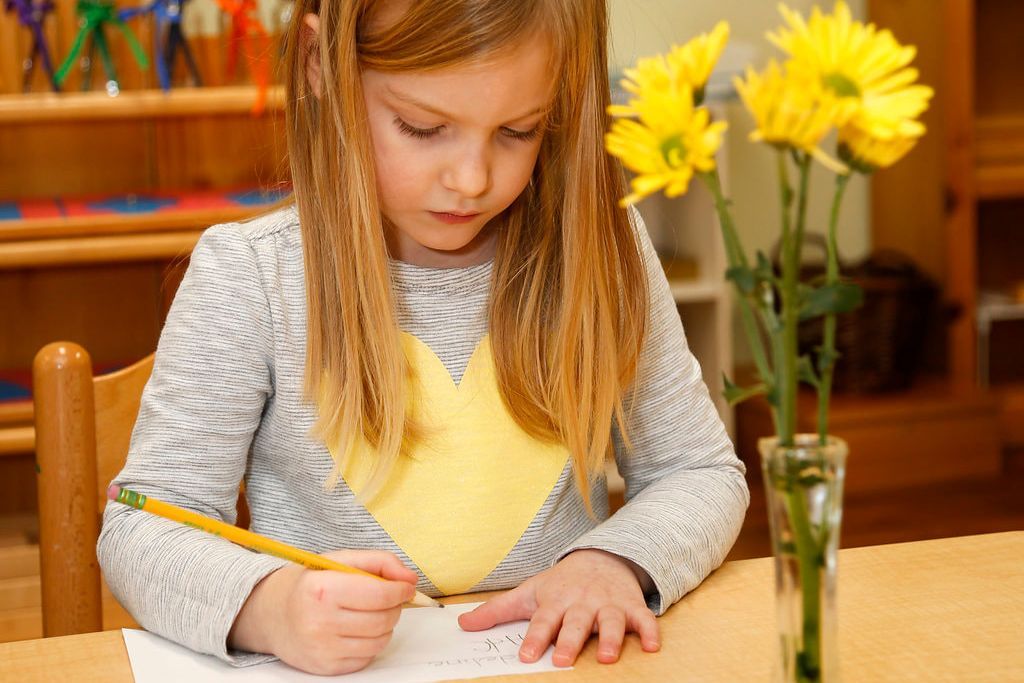 Montessori child working in the classroom