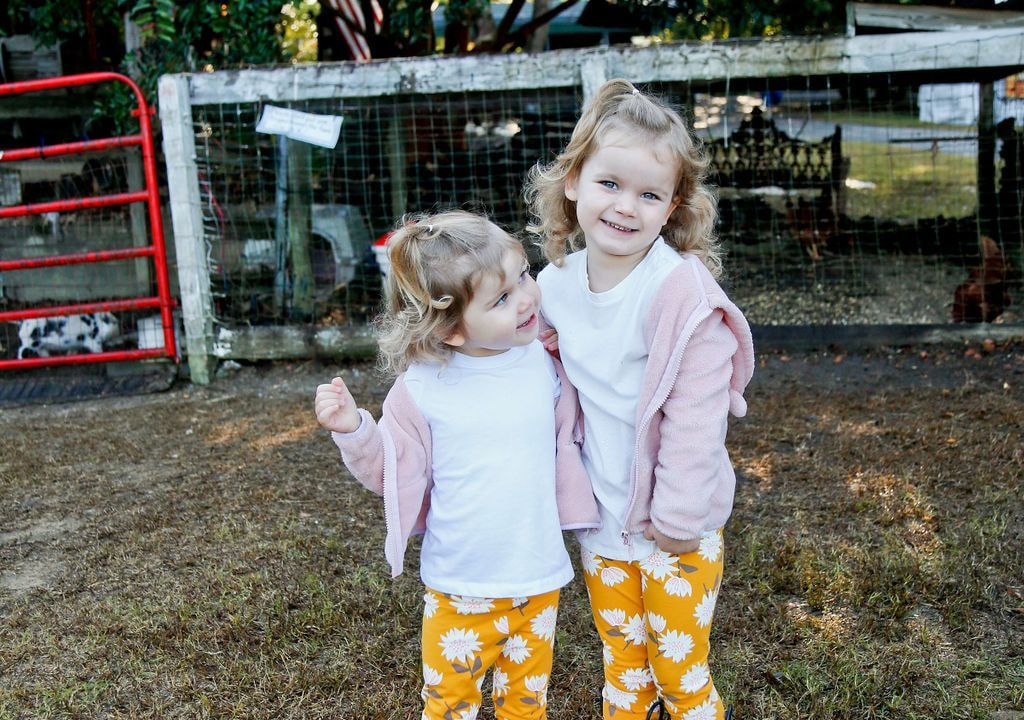 Montessori girls enjoying the farm