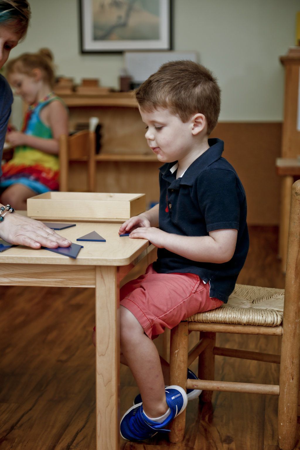 Montessori child working on a geometry exercise