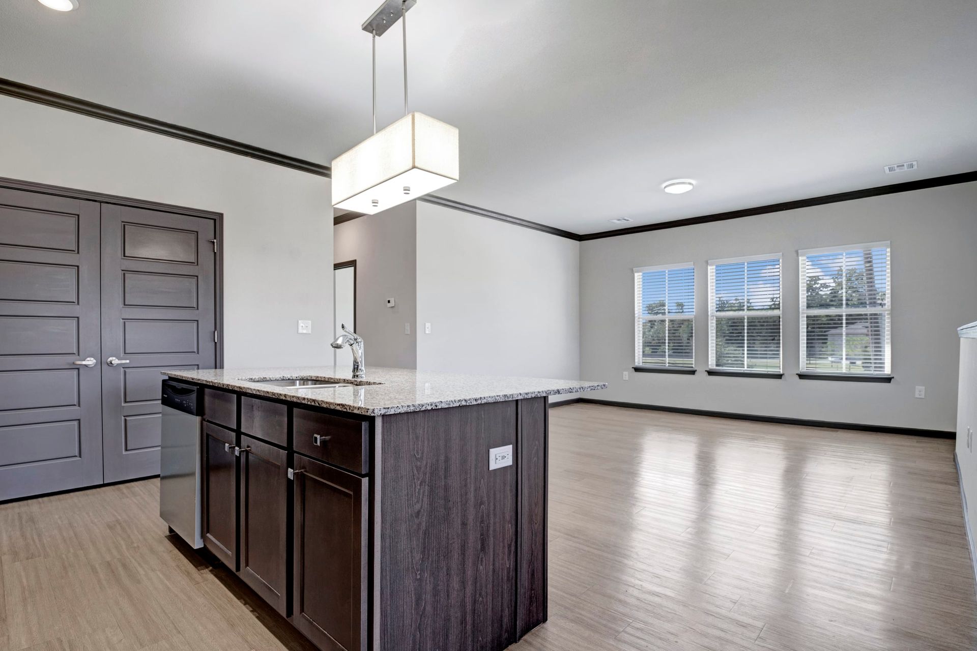 A kitchen with a large island in the middle of the room.