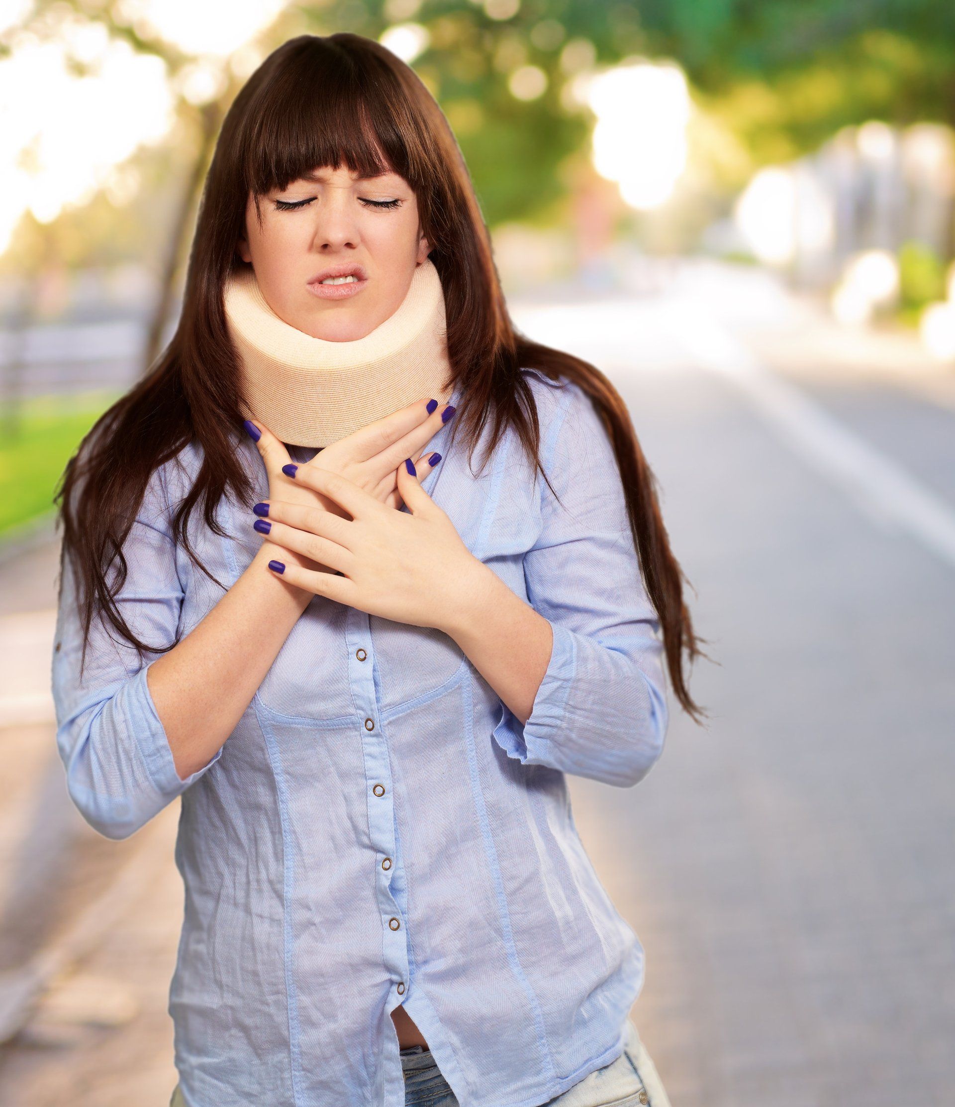 Woman holding her neck in a neck brace after an injury at no fault to her