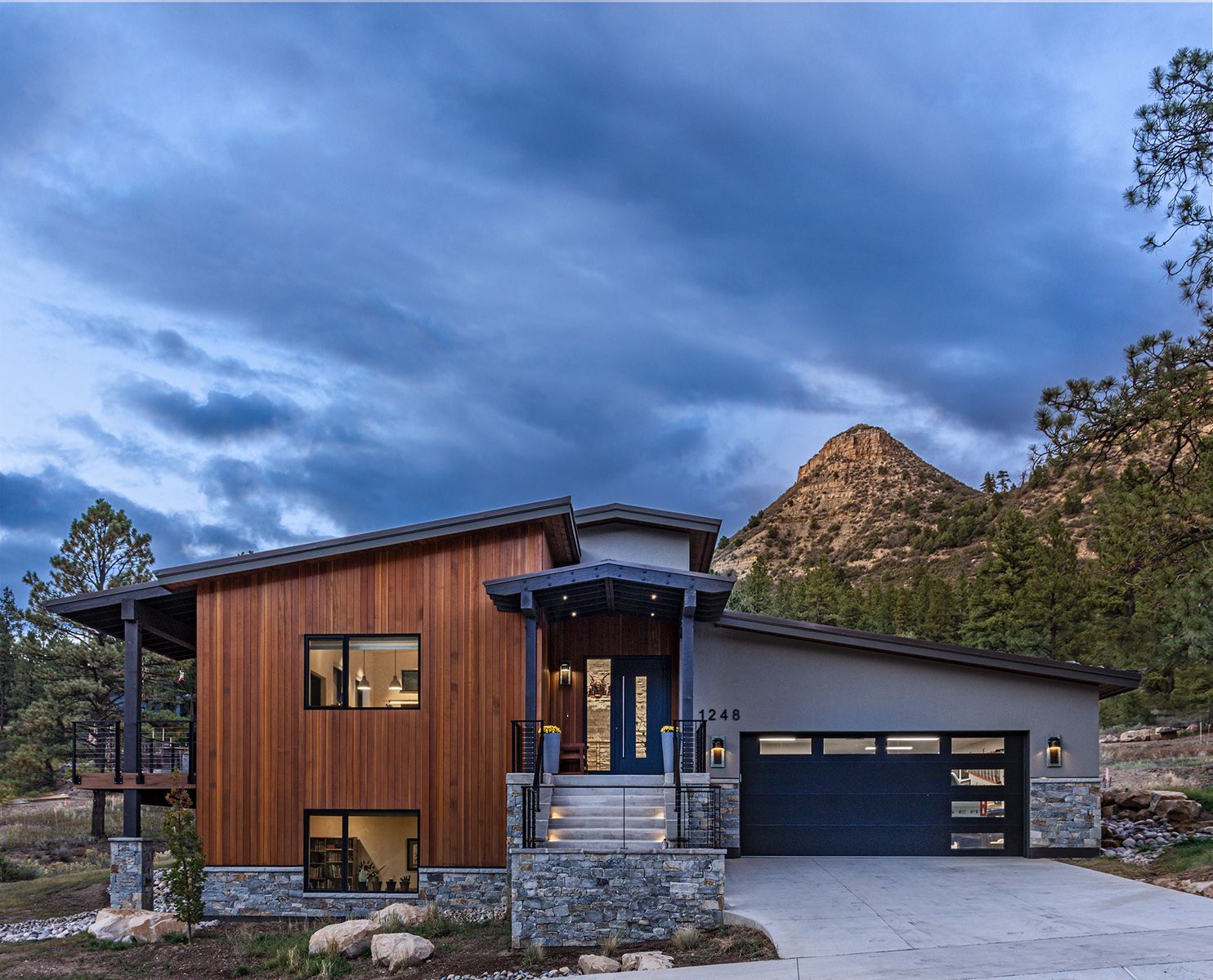 A modern house with a mountain in the background