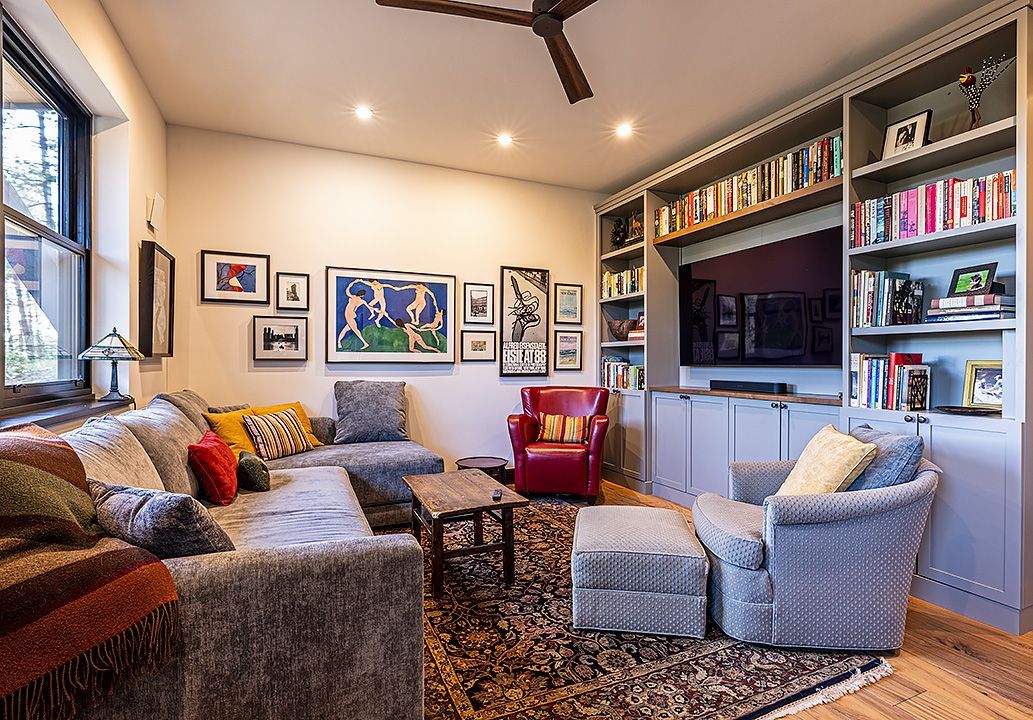A living room filled with furniture and a television.