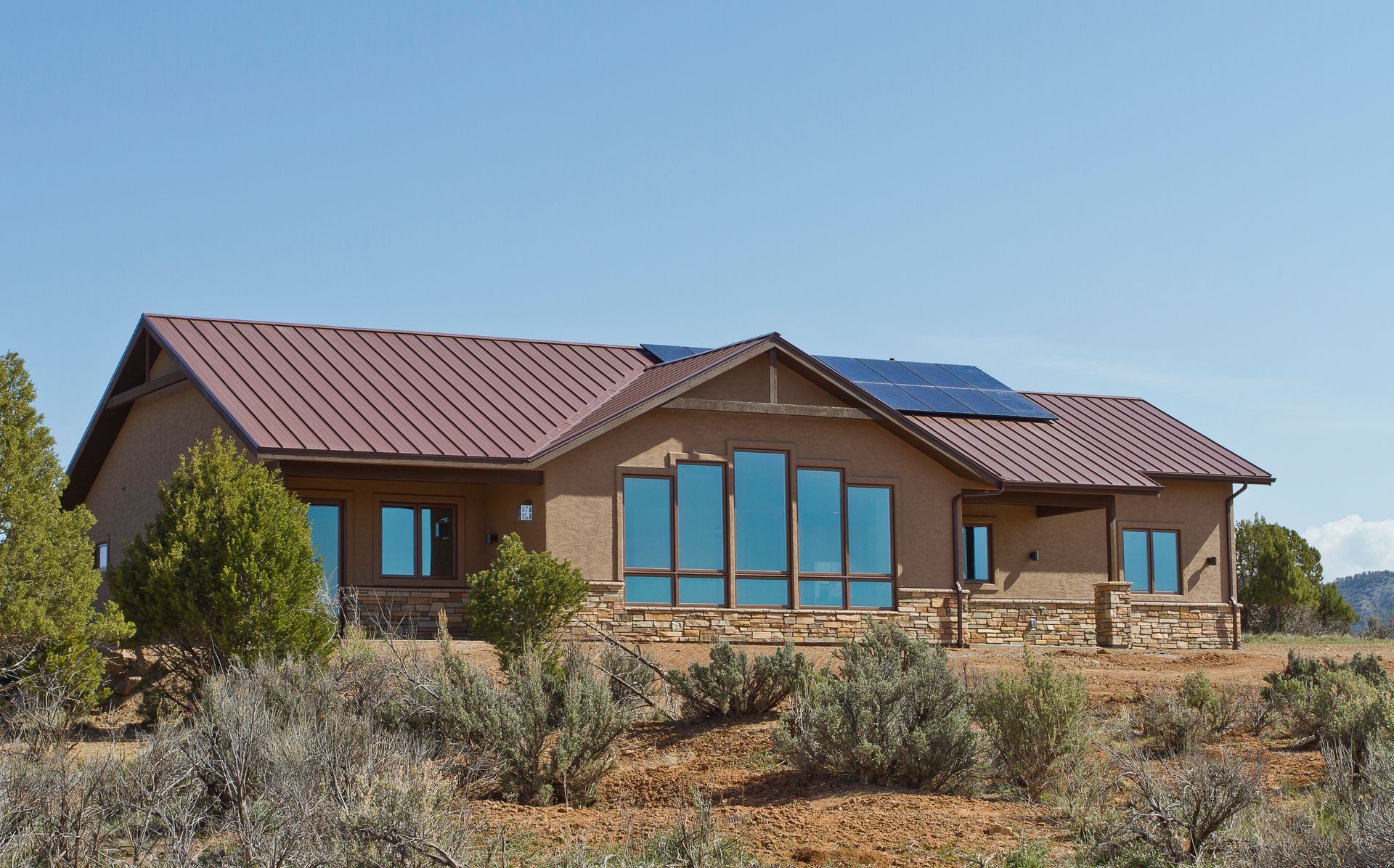 A house with a solar panel on the roof