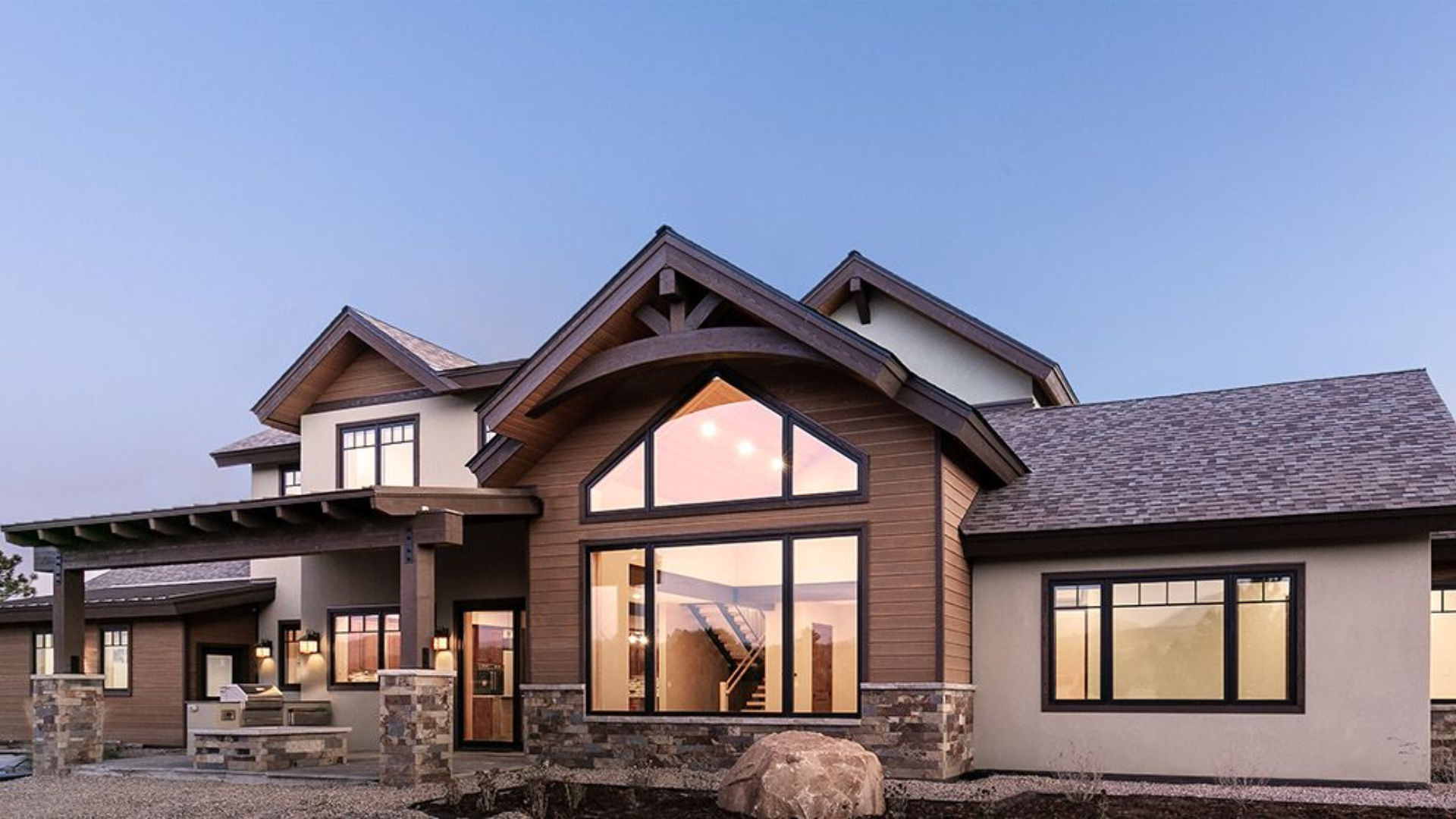 A kitchen with wooden cabinets and a large island in the middle