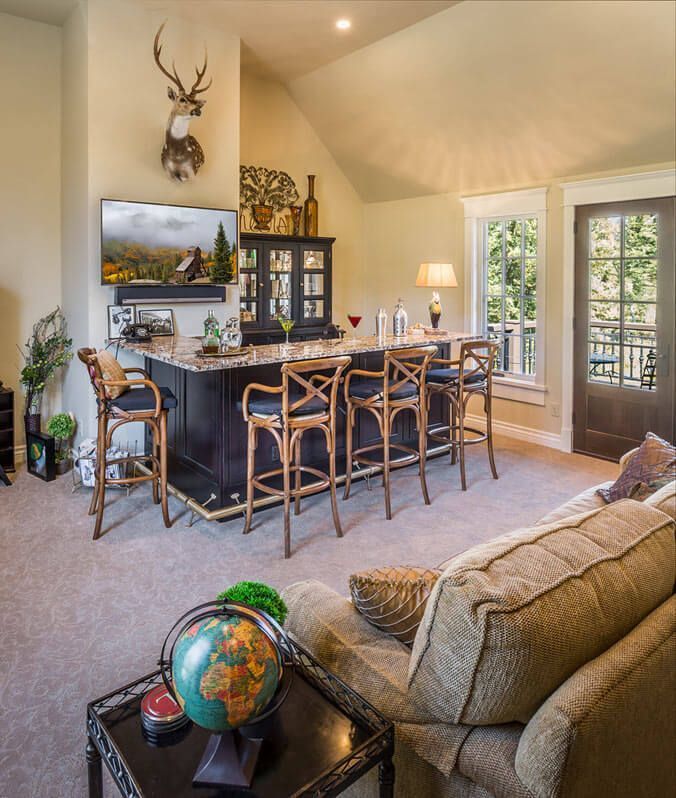 A living room with a bar and a globe on a table