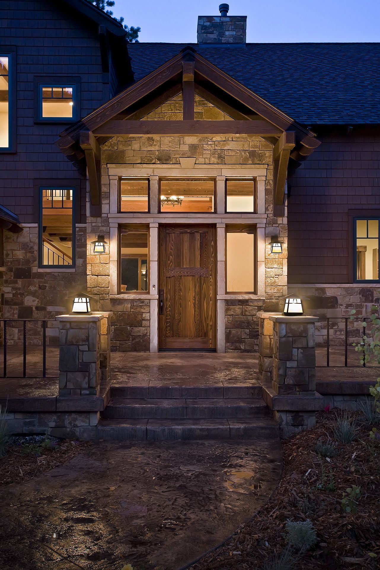 The front door of a house is lit up at night