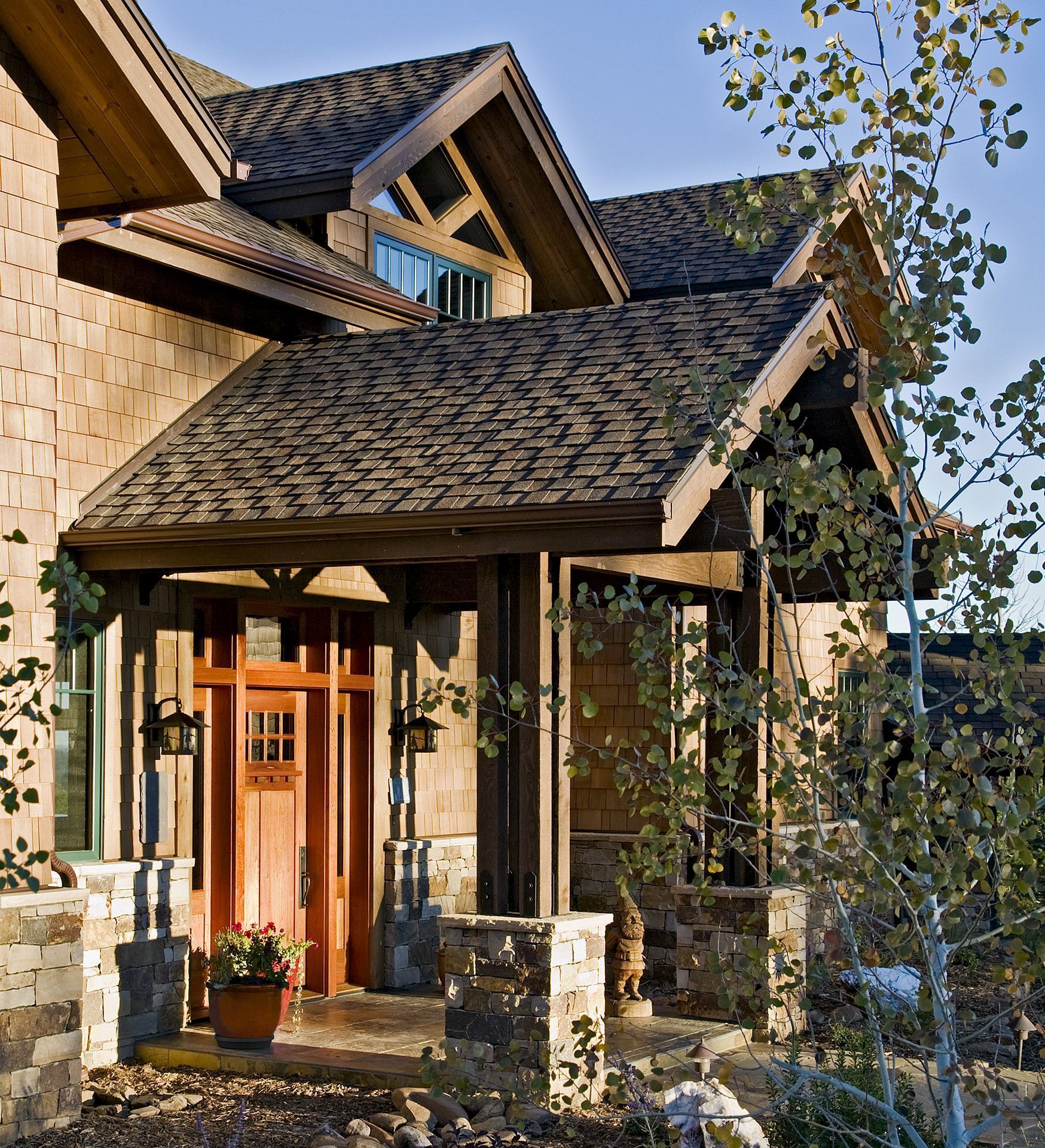 A house with a roof that has shingles on it