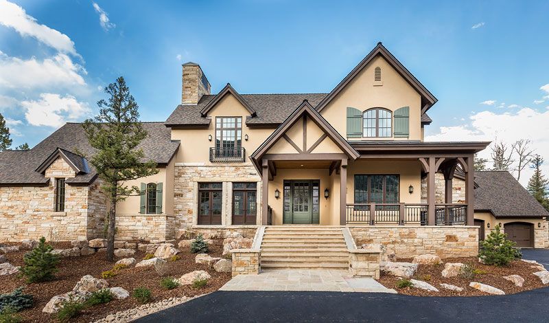 A large house with a lot of windows and stairs