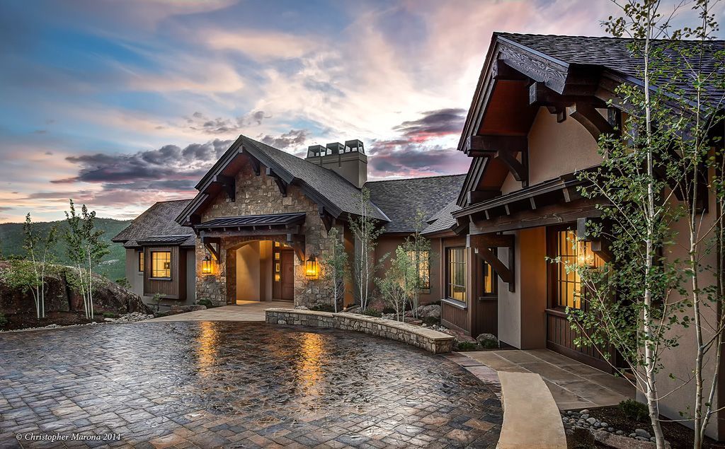 A living room with a table and chairs and a chandelier