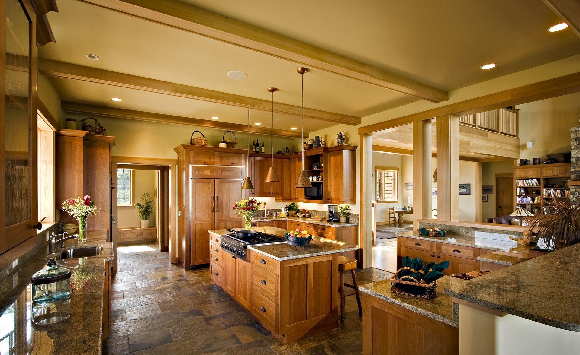 A large kitchen with wooden cabinets and granite counter tops