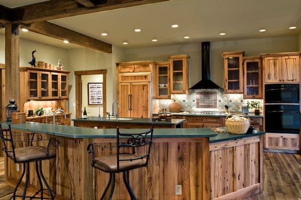 A kitchen with wooden cabinets and a green counter top