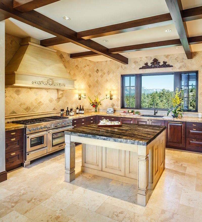 A kitchen with a large island in the middle
