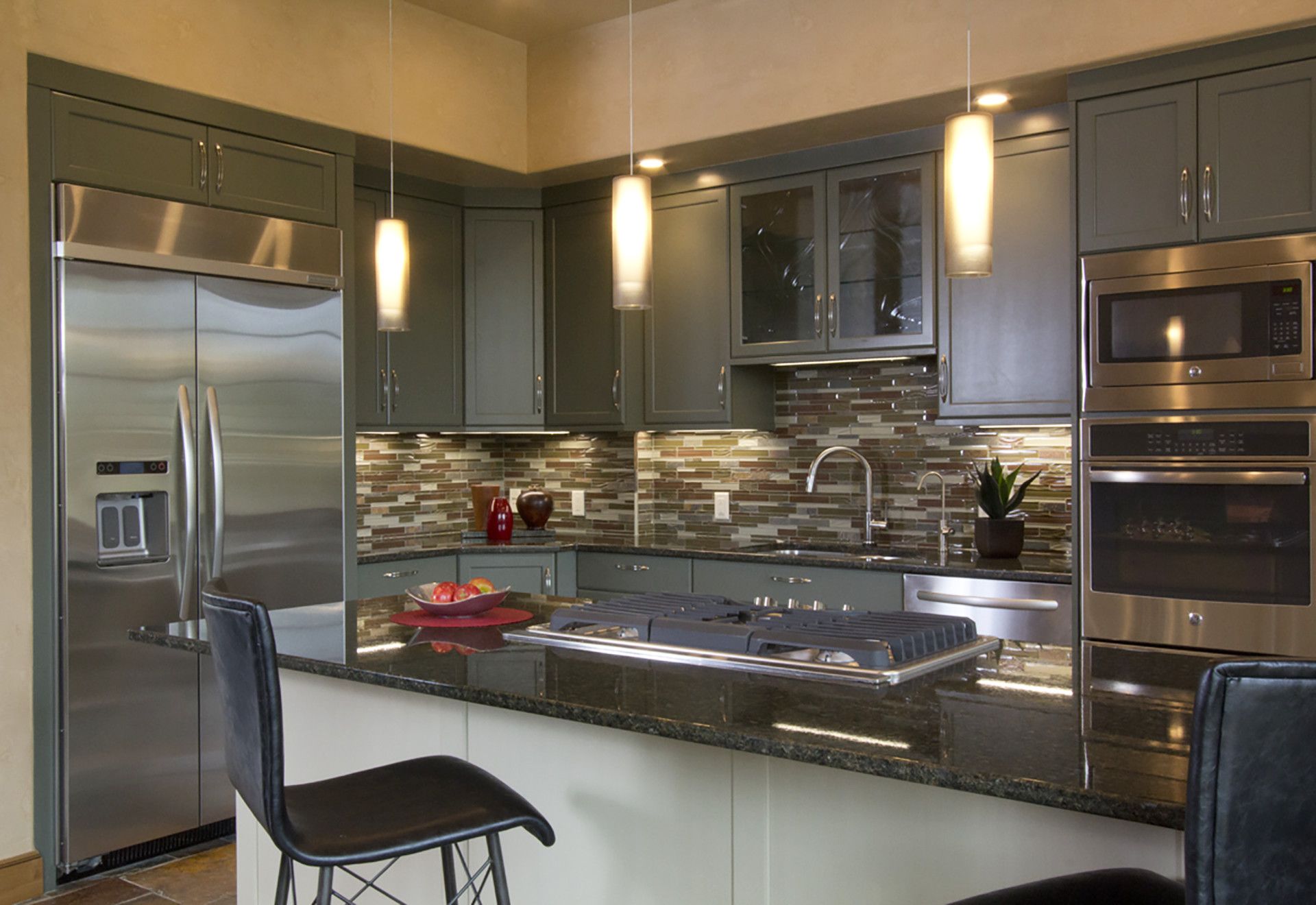 A kitchen with stainless steel appliances and granite counter tops