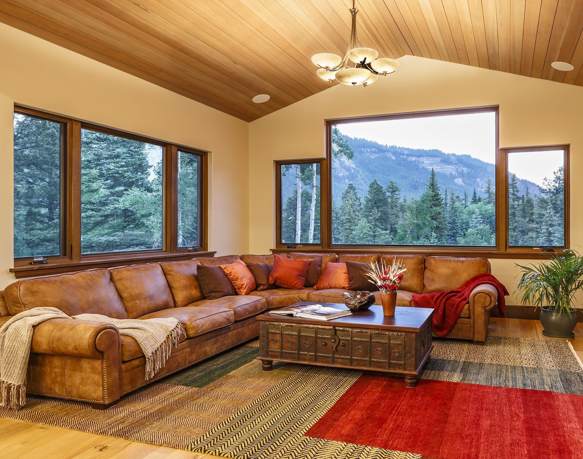 A living room with a large sectional couch and a coffee table