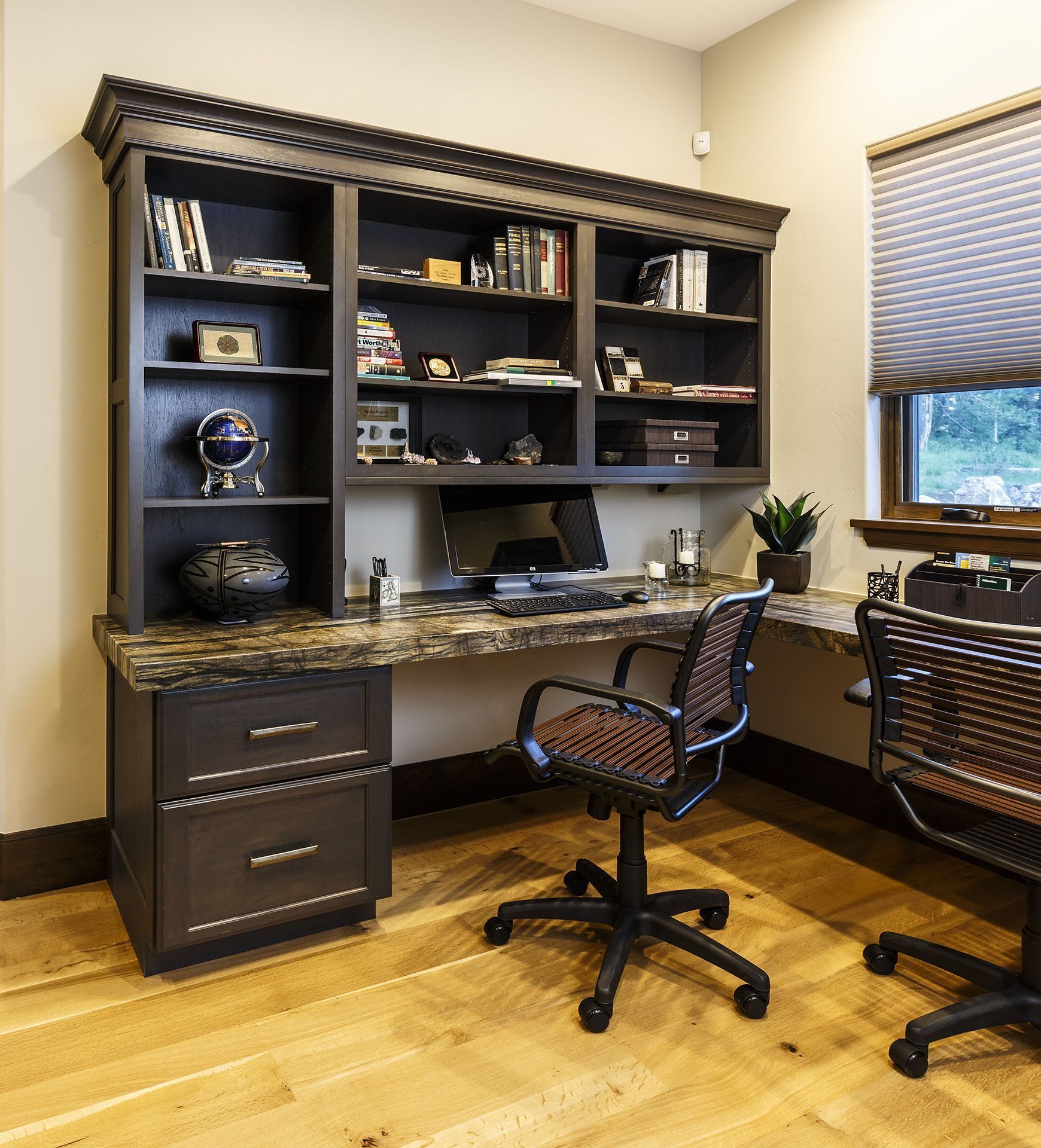 A home office with a desk and two chairs