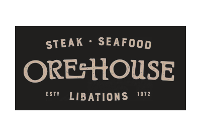 The logo for ore house steak and seafood is black and white