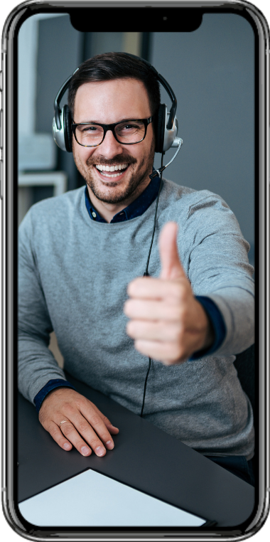 a man wearing headphones and glasses is giving a thumbs up .