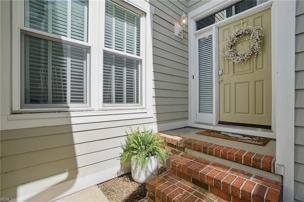 The front door of a house with a wreath on it