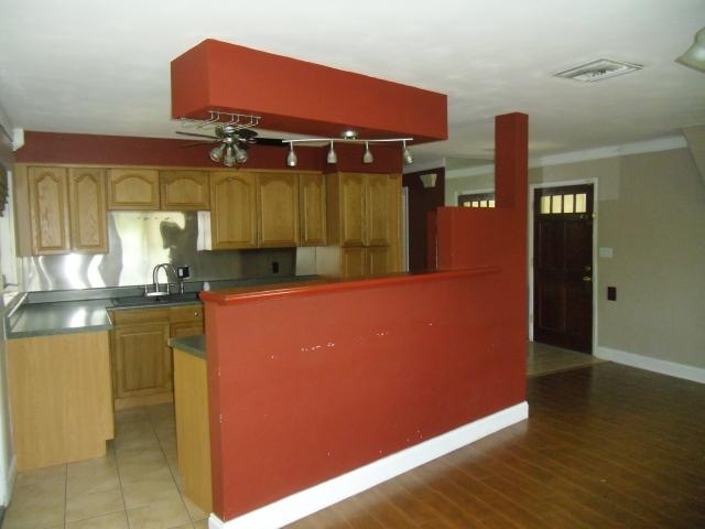 Kitchen with Red Wall Design - plumbing services in Cape Coral, FL