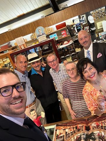 A group of people are posing for a picture in a store.