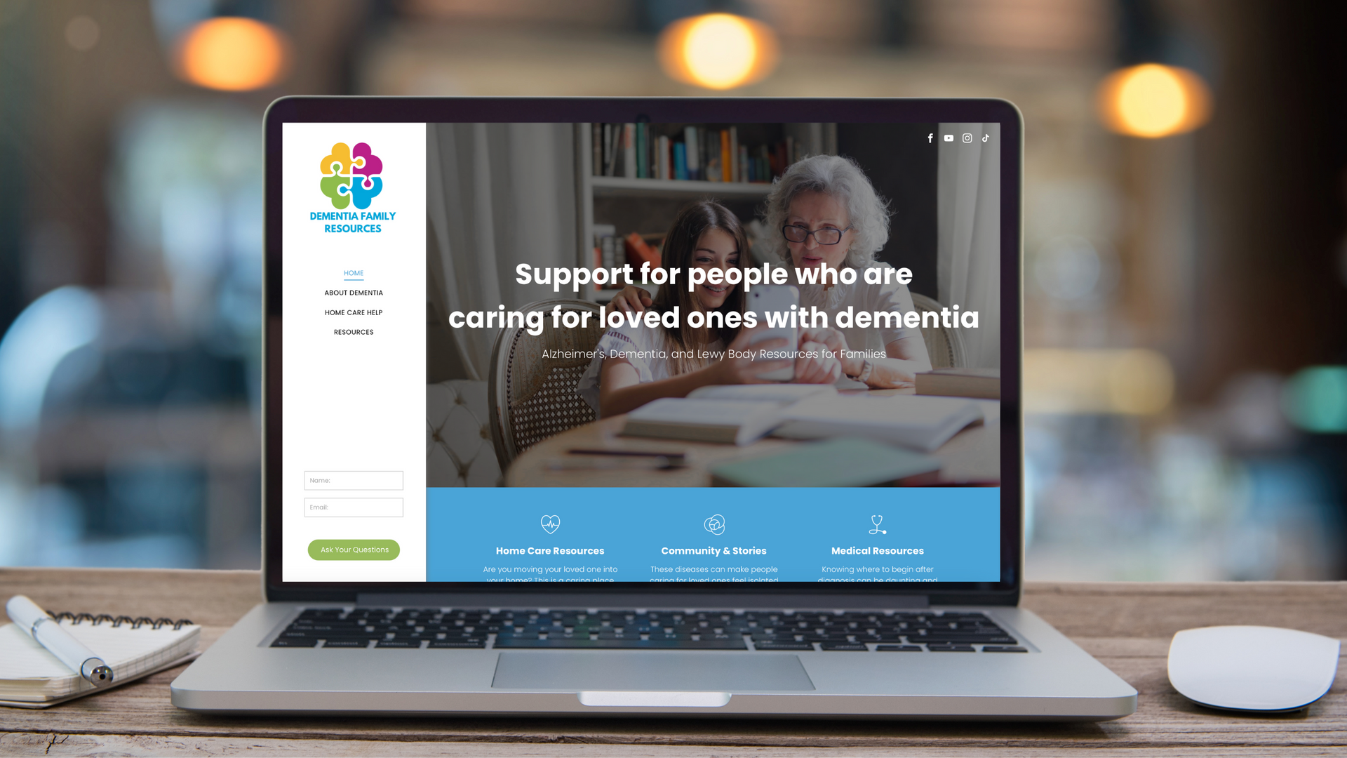 A laptop computer is open to a website that says support for people who are caring for loved ones with dementia.