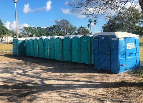 Teal and Blue Portable Toilets — Miami, FL — A.E.S. Portable Sanitation, Inc.