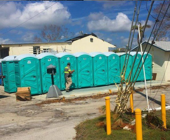Set of Teal Portable Toilets — Miami, FL — A.E.S. Portable Sanitation, Inc.