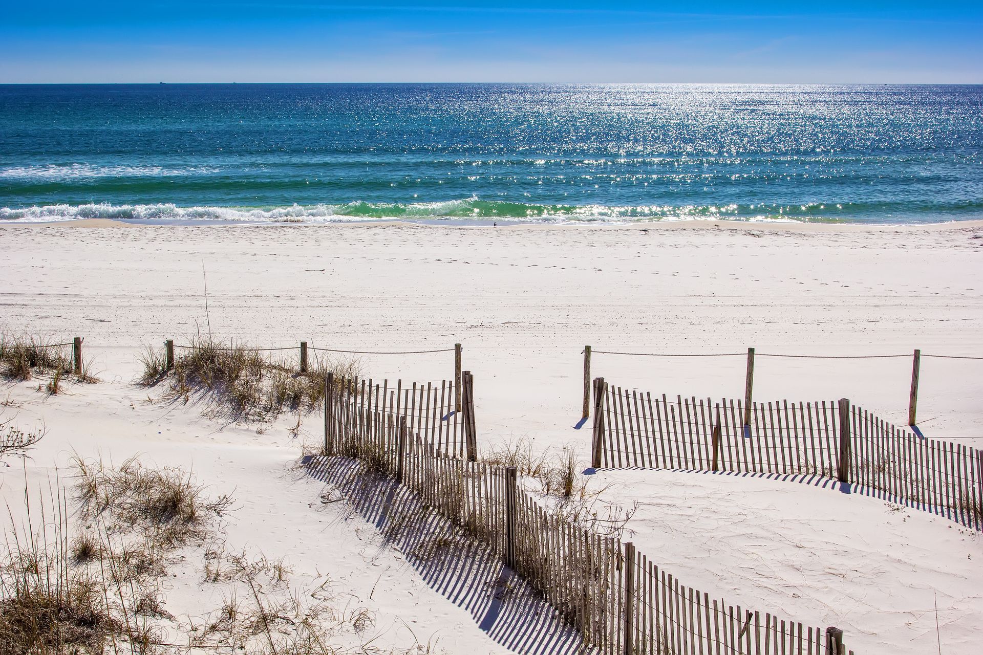 beach with fence in Panama City, FL